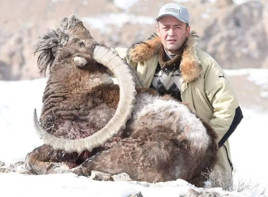 Hunter with Ibex
